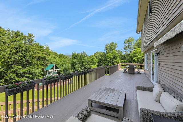 14 Glenerie Ln, Saugerties, NY 12477 - deck featuring a lawn, outdoor dining space, an outdoor hangout area, and a playground