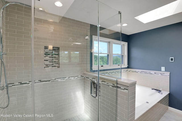 14 Glenerie Ln, Saugerties, NY 12477 - bathroom featuring a shower stall, a bath, a skylight, and recessed lighting
