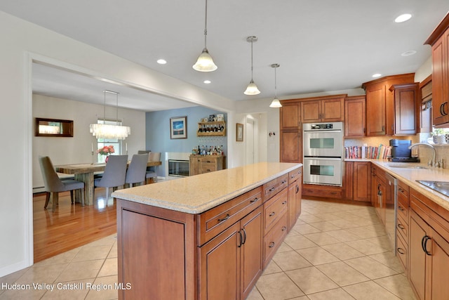 14 Glenerie Ln, Saugerties, NY 12477 - kitchen with stainless steel double oven, light tile patterned flooring, a kitchen island, plenty of natural light, and recessed lighting