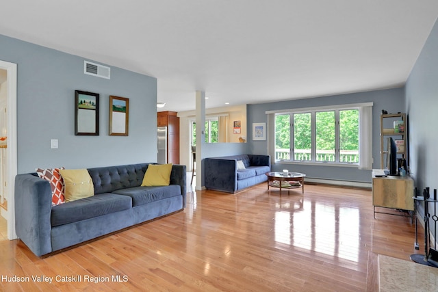 14 Glenerie Ln, Saugerties, NY 12477 - living area featuring a baseboard radiator and light wood finished floors