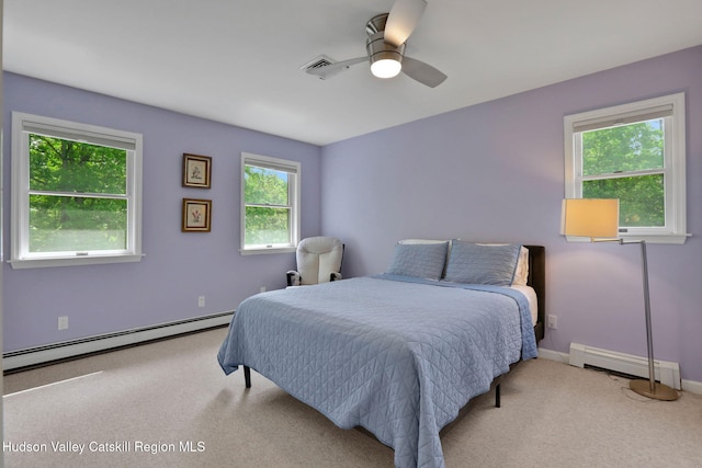14 Glenerie Ln, Saugerties, NY 12477 - bedroom with a baseboard heating unit, carpet floors, and ceiling fan
