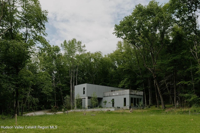50 High View Ln, Staatsburg, NY 12580 - view of green lawn featuring a wooded view