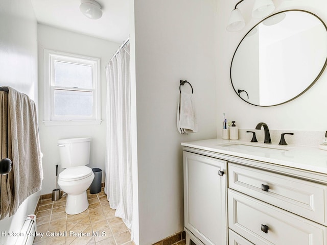 bathroom with toilet, tile patterned floors, a baseboard radiator, and vanity