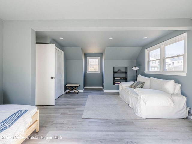 bedroom with recessed lighting, baseboards, and wood finished floors