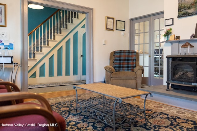 living room featuring french doors and hardwood / wood-style floors