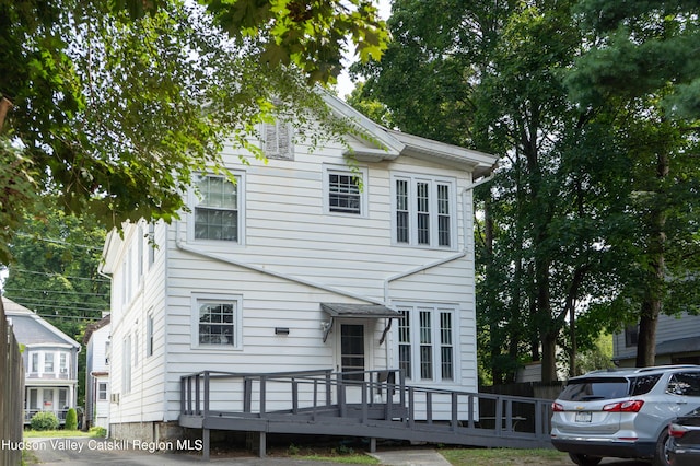 view of front of house featuring a deck