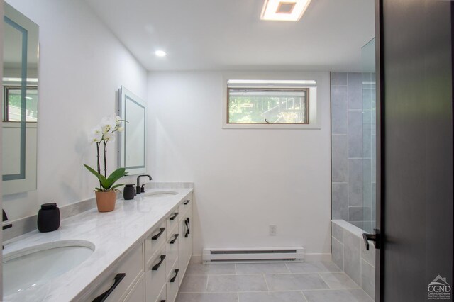 41 Snydertown Rd, Craryville, NY 12521 - full bath featuring a baseboard radiator, tile patterned flooring, double vanity, a shower, and recessed lighting