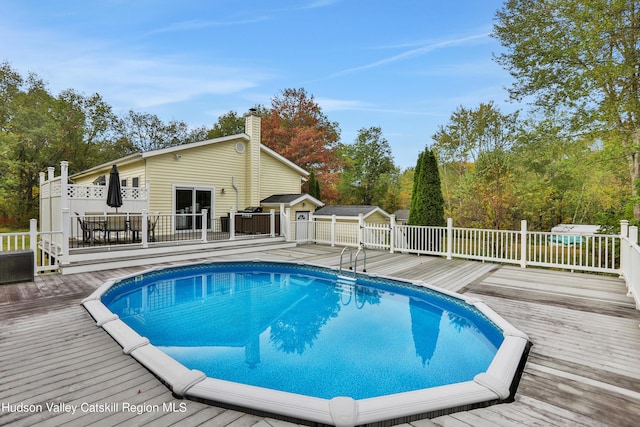 view of pool featuring a deck