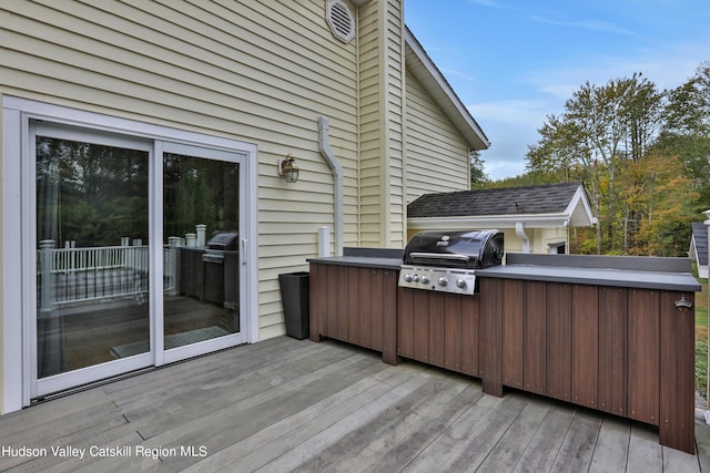 wooden deck with area for grilling