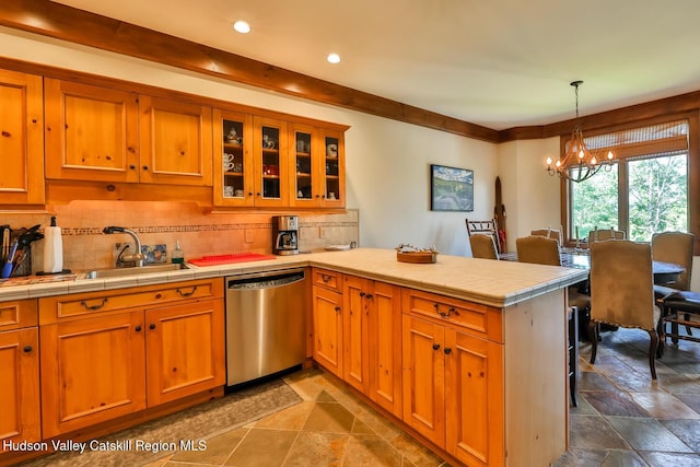 2 Watch Hill Ln Unit 2, Windham, NY 12496 - kitchen featuring dishwasher, a peninsula, a chandelier, stone tile flooring, and decorative backsplash