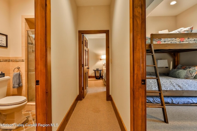 2 Watch Hill Ln Unit 2, Windham, NY 12496 - corridor featuring light colored carpet and tile walls