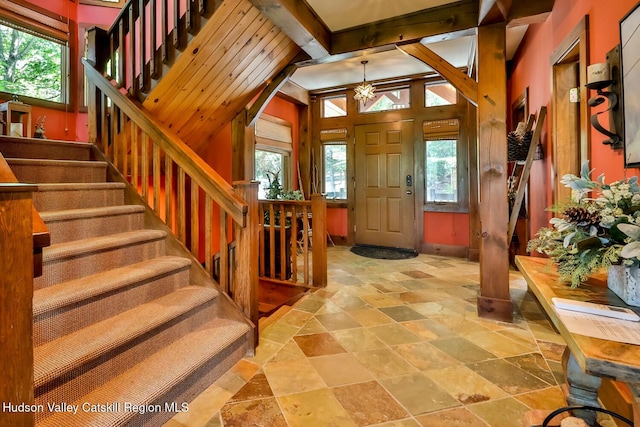 2 Watch Hill Ln Unit 2, Windham, NY 12496 - foyer featuring stone tile flooring, healthy amount of natural light, stairs, and a chandelier