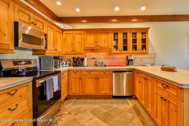 2 Watch Hill Ln Unit 2, Windham, NY 12496 - kitchen featuring stainless steel appliances, a peninsula, recessed lighting, tasteful backsplash, and tile countertops