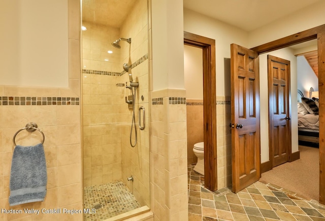 2 Watch Hill Ln Unit 2, Windham, NY 12496 - full bath with tile walls, a tile shower, a wainscoted wall, and ensuite bathroom