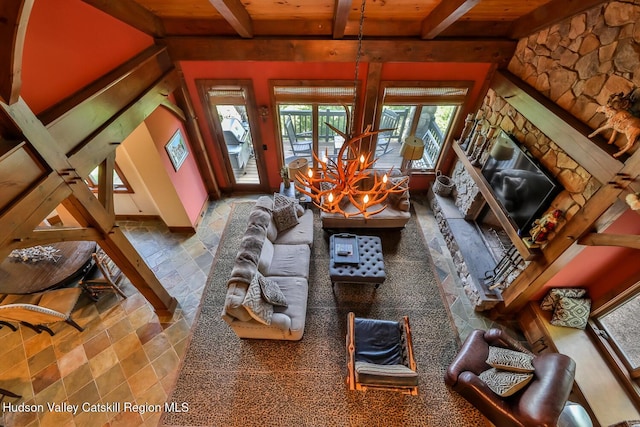 2 Watch Hill Ln Unit 2, Windham, NY 12496 - living room featuring a wooden ceiling with exposed beams and stone tile flooring