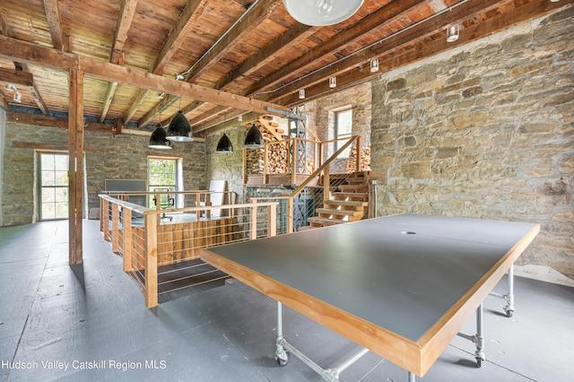 rec room with wooden ceiling and vaulted ceiling with beams