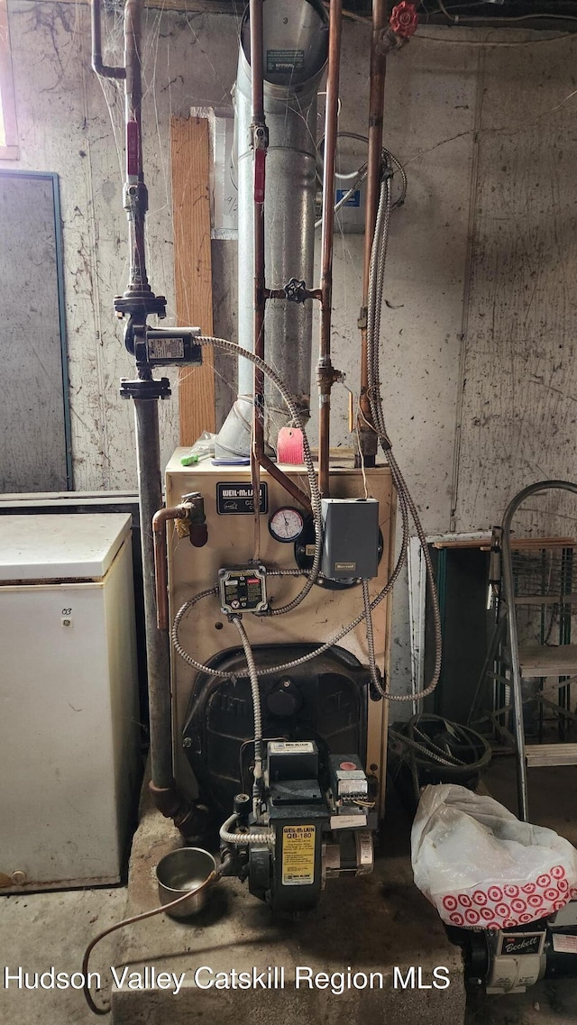 utility room featuring a heating unit