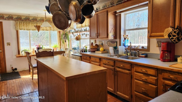 kitchen with brown cabinets, light countertops, and a center island