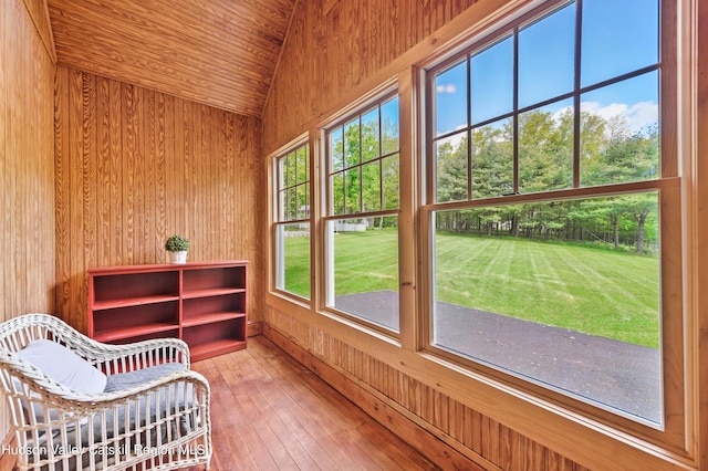 unfurnished sunroom with plenty of natural light, wooden ceiling, and vaulted ceiling