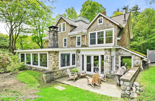 back of house featuring french doors and a patio