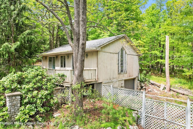 view of side of home featuring a garage