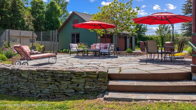 511 County Route 10, Germantown, NY 12526 - view of patio with an attached garage and outdoor dining area