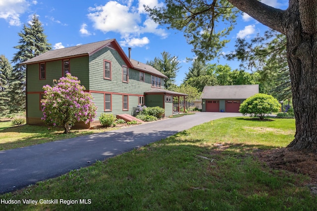 511 County Route 10, Germantown, NY 12526 - view of front of home with a garage, an outbuilding, and a front yard