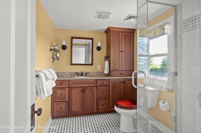 511 County Route 10, Germantown, NY 12526 - bathroom with toilet, vanity, baseboards, and a shower with shower door