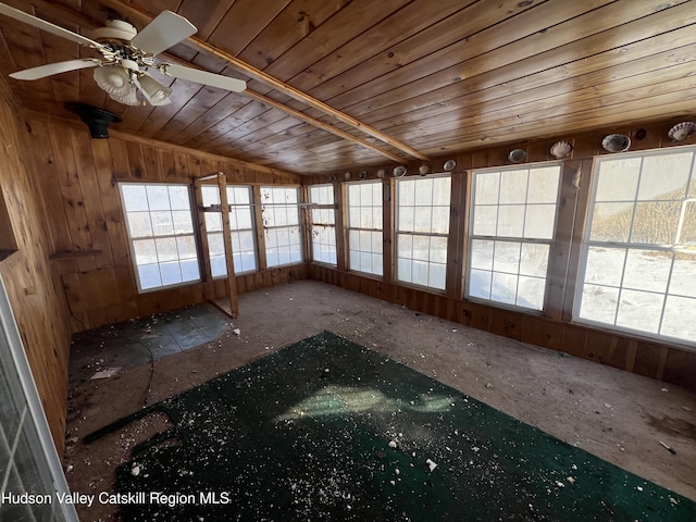 unfurnished sunroom with vaulted ceiling and ceiling fan