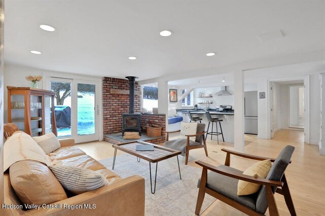 21 Schroon Hill Rd, Kerhonkson, NY 12446 - living room featuring recessed lighting, a wood stove, and light wood-style floors