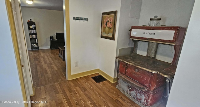 hallway with dark wood-type flooring