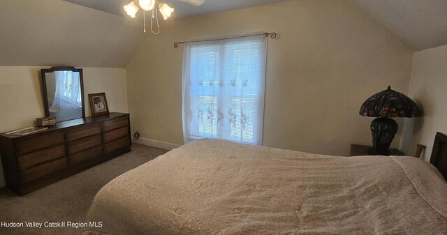 carpeted bedroom with ceiling fan and lofted ceiling