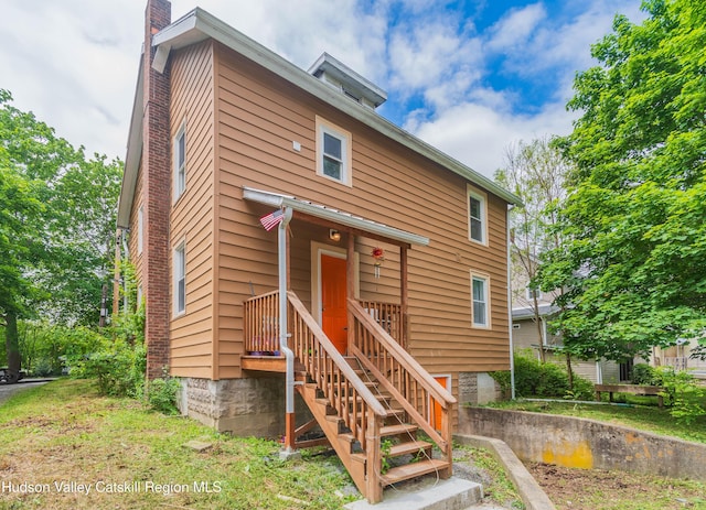 24 Grove St, Cairo, NY 12413 - rear view of house featuring a chimney