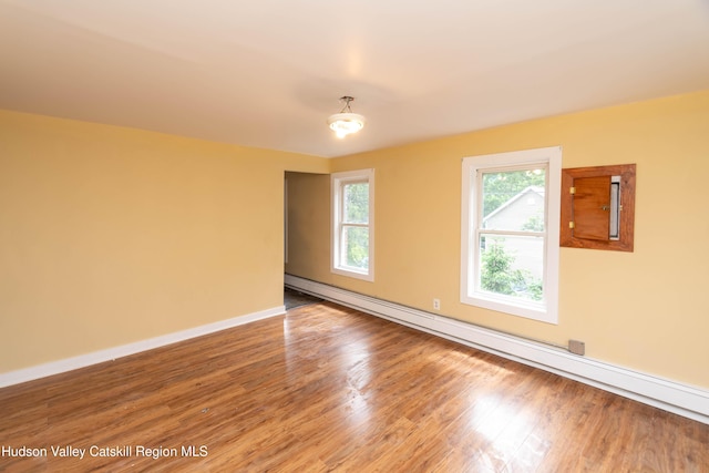 24 Grove St, Cairo, NY 12413 - spare room featuring baseboard heating and wood finished floors