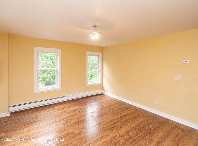 24 Grove St, Cairo, NY 12413 - spare room with baseboard heating and wood finished floors