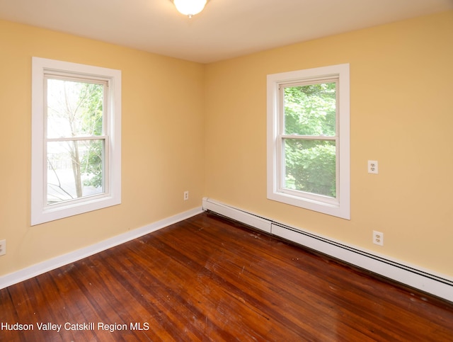 24 Grove St, Cairo, NY 12413 - empty room featuring baseboard heating and dark wood finished floors