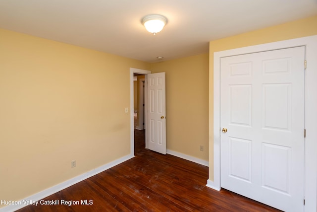 24 Grove St, Cairo, NY 12413 - unfurnished bedroom with dark wood-style floors and baseboards