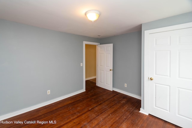 24 Grove St, Cairo, NY 12413 - unfurnished bedroom featuring dark wood finished floors and baseboards