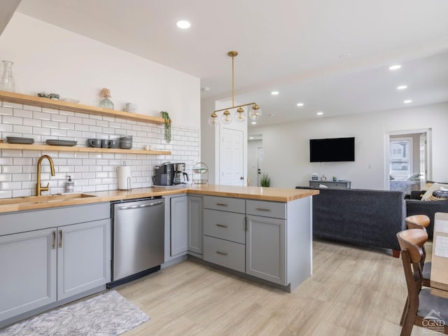 7614 Main St, Hunter, NY 12444 - kitchen with wooden counters, dishwasher, gray cabinets, a sink, and tasteful backsplash
