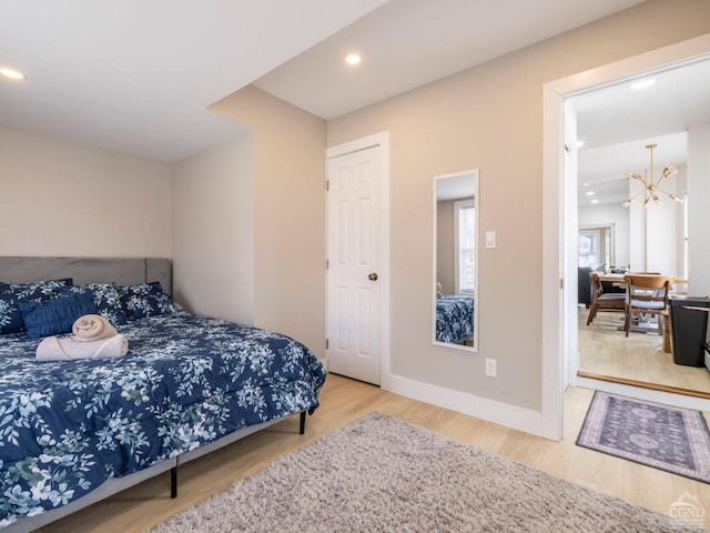 7614 Main St, Hunter, NY 12444 - bedroom featuring a chandelier, wood finished floors, recessed lighting, and baseboards