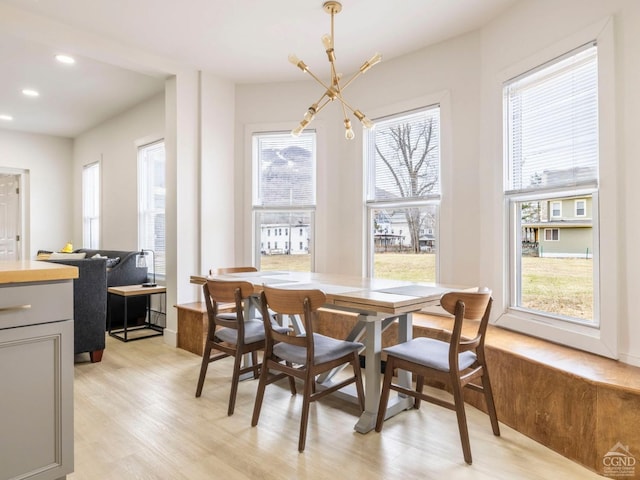 7614 Main St, Hunter, NY 12444 - dining room featuring a chandelier, light wood-type flooring, healthy amount of natural light, and recessed lighting
