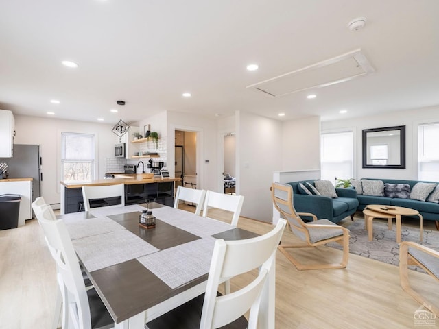 7614 Main St, Hunter, NY 12444 - dining space featuring attic access, light wood-style flooring, plenty of natural light, and recessed lighting