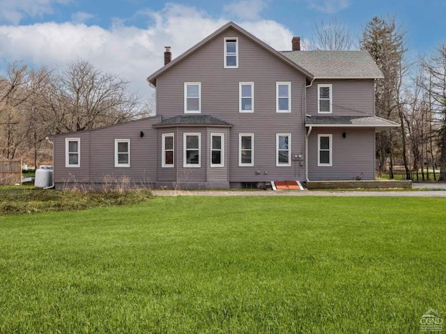 7614 Main St, Hunter, NY 12444 - rear view of house with a chimney, a yard, and roof with shingles