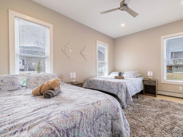7614 Main St, Hunter, NY 12444 - bedroom with baseboard heating, ceiling fan, wood finished floors, and recessed lighting