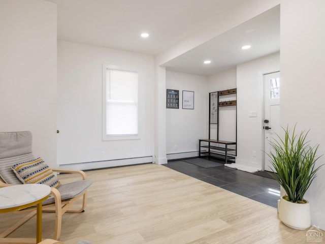 7614 Main St, Hunter, NY 12444 - sitting room featuring a baseboard radiator, wood finished floors, recessed lighting, and baseboards