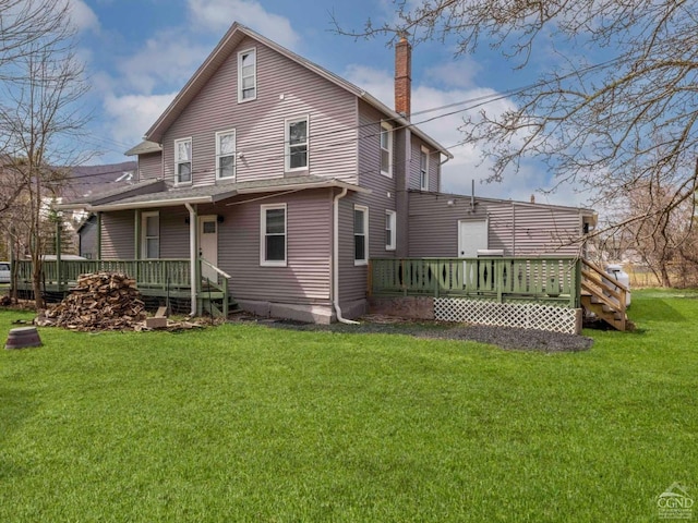 7614 Main St, Hunter, NY 12444 - rear view of property with a chimney, a yard, and a deck