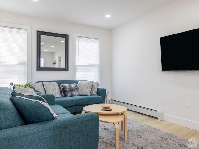 7614 Main St, Hunter, NY 12444 - living area with a baseboard heating unit, light wood-type flooring, recessed lighting, and baseboards