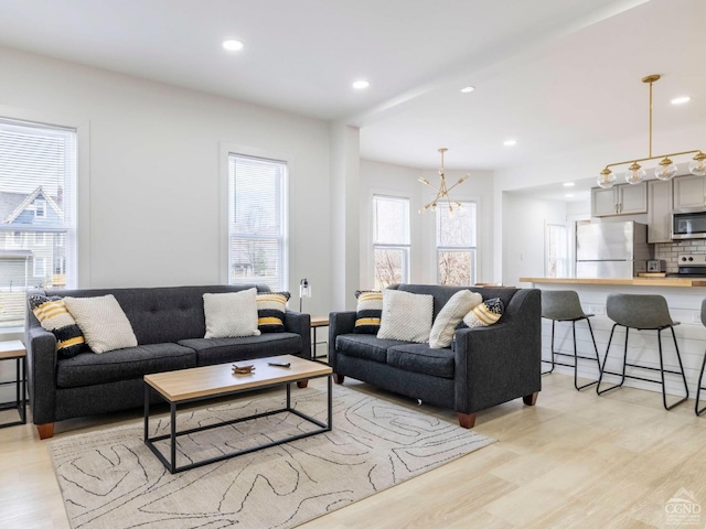 7614 Main St, Hunter, NY 12444 - living area featuring light wood finished floors, recessed lighting, and a chandelier
