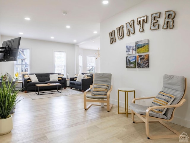 7614 Main St, Hunter, NY 12444 - sitting room with light wood-style floors, recessed lighting, baseboards, and a chandelier