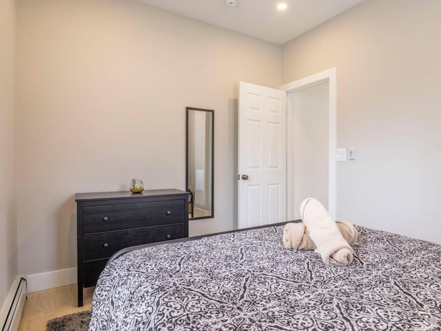 7614 Main St, Hunter, NY 12444 - bedroom with baseboard heating, recessed lighting, and baseboards